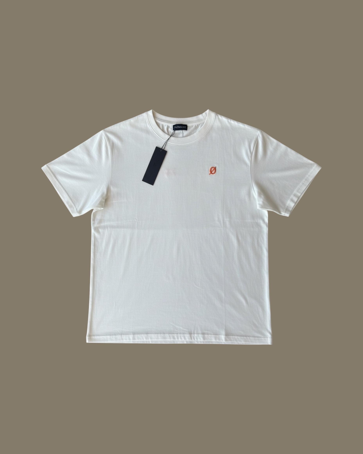 White NØMADZ Essential Tee with a small orange chest logo