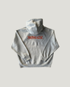 NØMADZ grey oversized hoodie back view with orange 3D embroidered logo