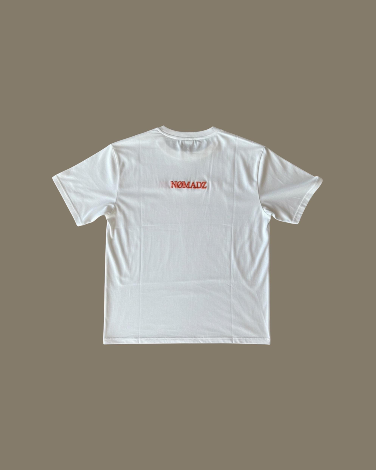 NØMADZ white men's T-shirt with orange logo on the back