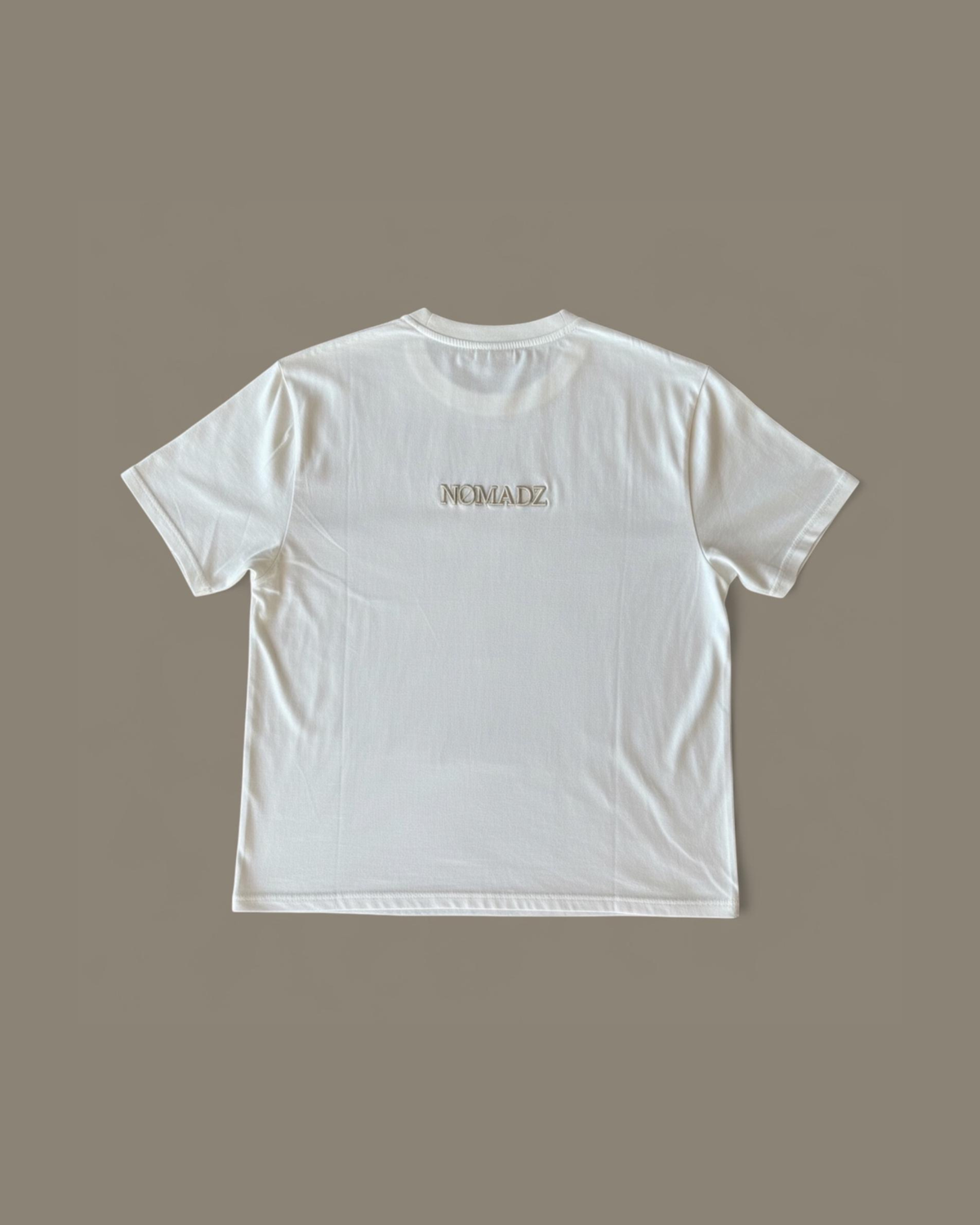 NØMADZ white women's one-size T-shirt with beige logo on the back
