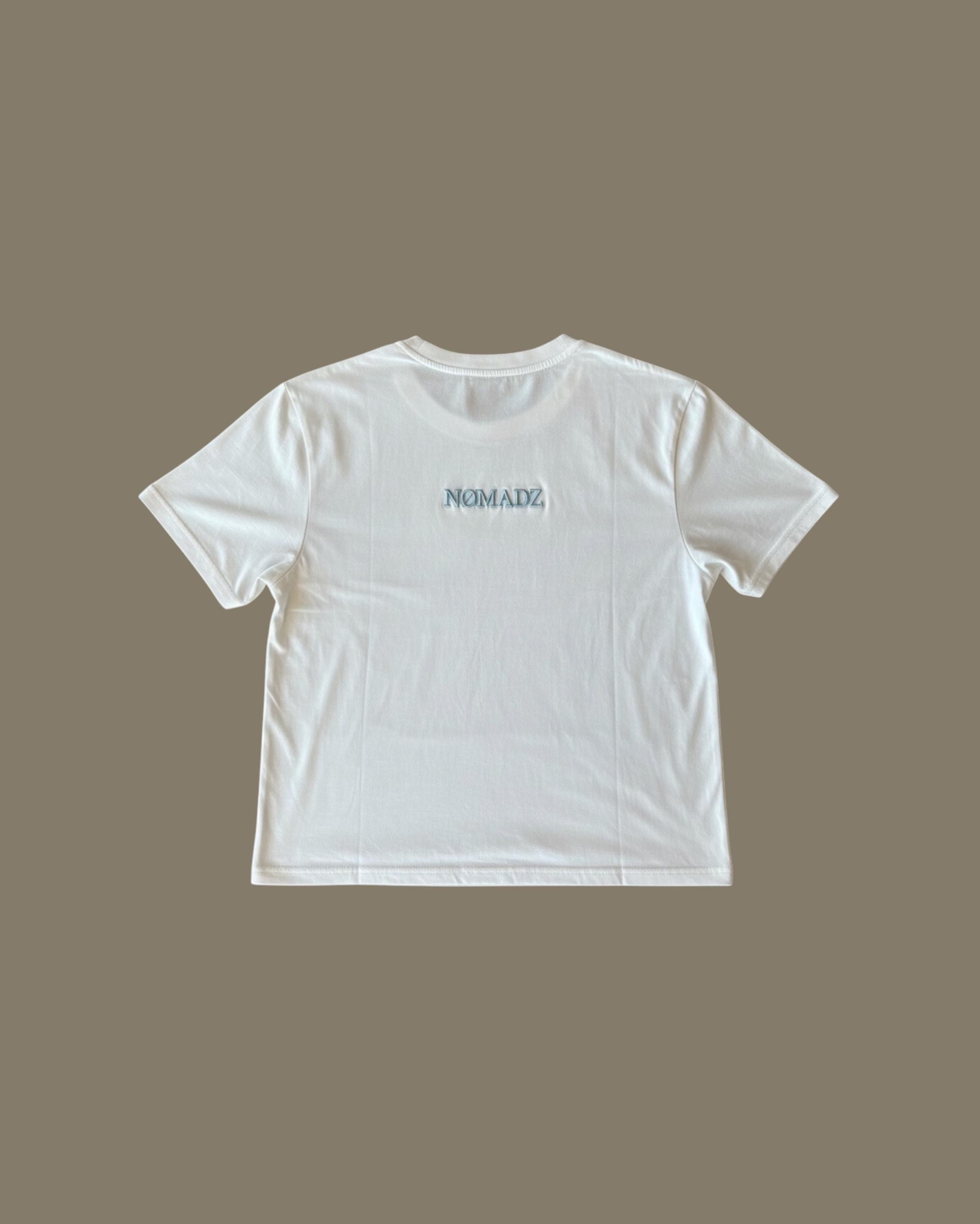 NØMADZ white women's one-size T-shirt with light blue logo on the back